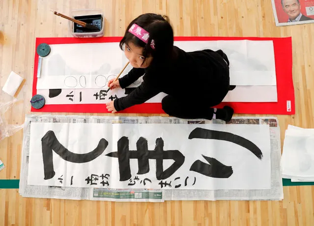 A girl participates in a New Year calligraphy contest in Tokyo, Japan, January 5, 2018. (Photo by Kim Kyung-Hoon/Reuters)