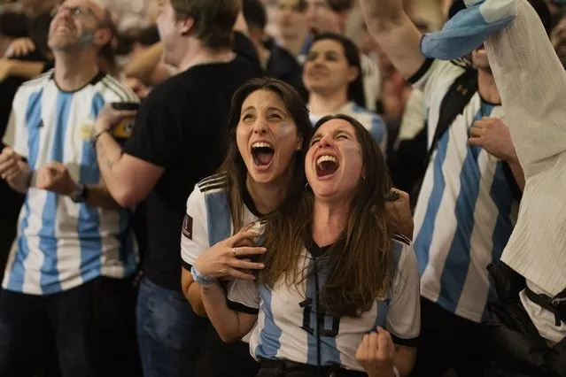Argentina fans celebrate in a bar in Barcelona, Spain during the World Cup final soccer match between Argentina and France in Qatar, Sunday, December18, 2022. (Photo by Emilio Morenatti/AP Photo)