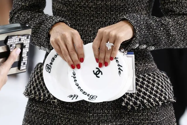 The handbag of an unidentified guest is pictured at the Grand Palais which is transformed into a Chanel airport before German designer Karl Lagerfeld's Spring/Summer 2016 women's ready-to-wear collection for French fashion house Chanel during Fashion Week in Paris, France, October 6, 2015. (Photo by Benoit Tessier/Reuters)