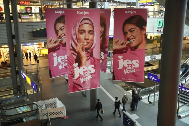 Advertisements for a new line of vegetarian sweets by German candymaker Katjes feature a Muslim woman wearing a headscarf and three non-covered women at Hauptbahnhof railway station on January 31, 2018 in Berlin, Germany. The campaign, which also has video clips that are running online, has provoked indignant protest on social media by critics charging the campaign promotes suppression of women's rights and encourages the “Islamization” of Germany. Germany's AfD right-wing political party has risen to political prominence largely by successfully appealing to Germans who fear the presence of Muslim refugees and immigrants. (Photo by Sean Gallup/Getty Images)