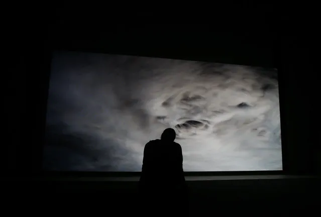 A man watches an installation by artist Philippe Parreno, part of the 'Hypothesis' exhibition, on display at the Hangar Bicocca in Milan, Italy, Thursday, October 29, 2015. (Photo by Luca Bruno/AP Photo)