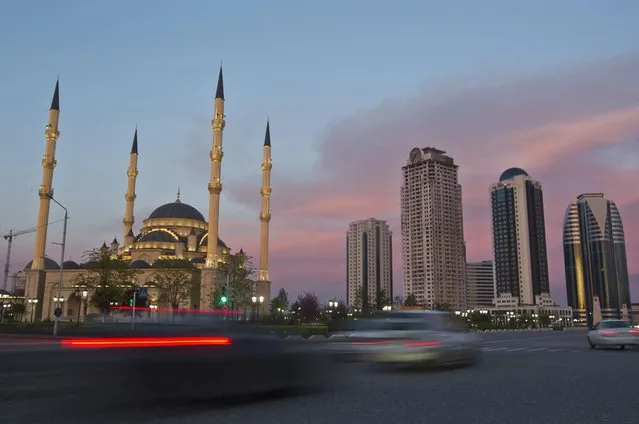 Cars drive along Akhmad Kadyrov Avenue, with the Heart of Chechnya mosque and skyscrapers in the background in the Chechen capital Grozny April 27, 2013. (Photo by Maxim Shemetov/Reuters)