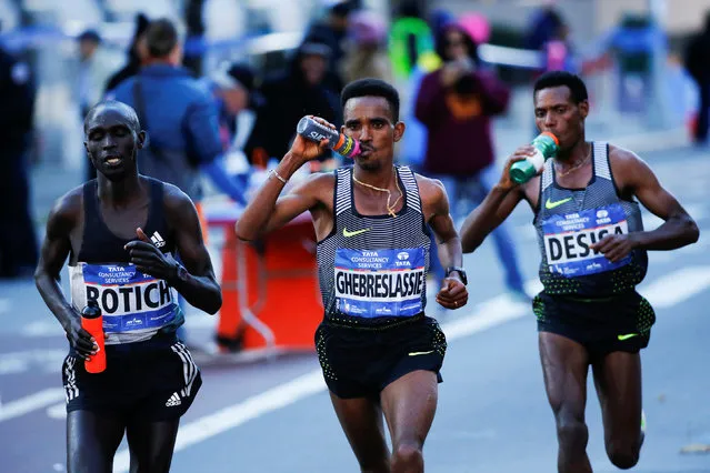 Ghirmay Ghebreslassie (C) of Eritrea leads the men's pack during the 2016 New York City Marathon in the Manhattan borough of New York City, NY, U.S. November 6, 2016. (Photo by Eduardo Munoz/Reuters)
