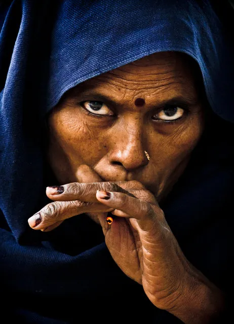 “The souls thief”. I captured this photo last year in Delhi. When I looked through the camera she stared at me and started to move from side to side. I often heard of ancient cultures whose members believed their souls could be stolen by taking pictures of them, so they generally refused to be photographed. In this case it was different. In fact, it was me who was intimidated by her movement and her penetrating gaze. In the few seconds we looked at each other, I really felt as if she was trying to capture my soul... and in some way, she did.  (Photo and caption by Carlos Rodríguez/National Geographic Traveler Photo Contest)
