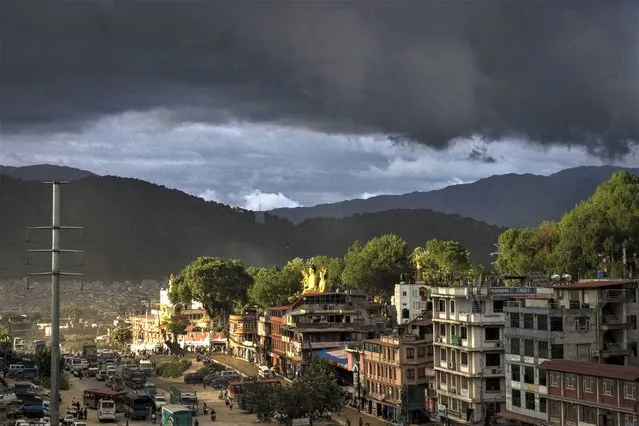 Rain clouds hover over Kathmandu city, Nepal, Wednesday, June 28, 2023. (Photo by Niranjan Shrestha/AP Photo)
