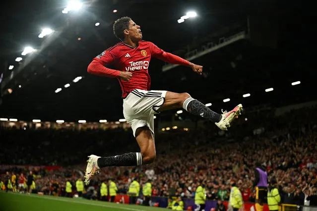 Raphael Varane of Manchester United celebrates scoring their first goal during the Premier League match between Manchester United and Wolverhampton Wanderers at Old Trafford on August 14, 2023 in Manchester, England. (Photo by Dylan Martinez/Reuters)