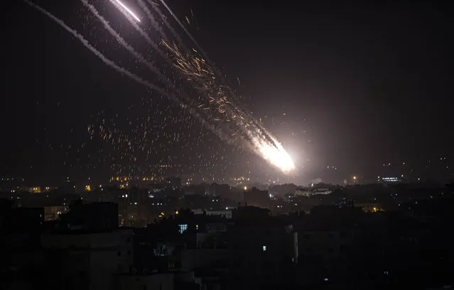 Rockets are launched from the Gaza Strip towards Israel, Monday, May. 10, 2021. Hamas militants fired dozens of rockets into Israel on Monday, including a barrage that set off air raid sirens as far away as Jerusalem, after hundreds of Palestinians were hurt in clashes with Israeli police at a flashpoint religious site in the contested holy city. (Photo by Khalil Hamra/AP Photo)