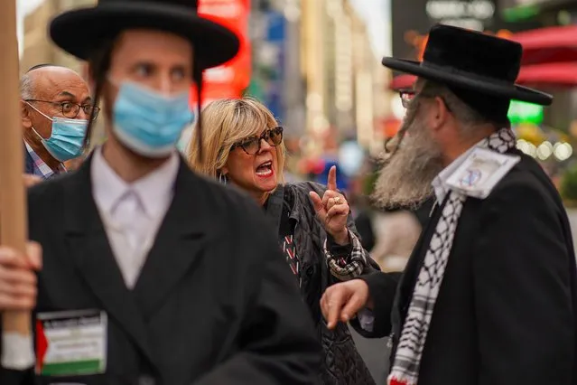 A Pro-Israel supporter confronts a Pro-Palestine ultra-Orthodox Jew during a Pro-Israel rally at Times Square in New York City, U.S., May 12, 2021. (Photo by David “Dee” Delgado/Reuters)