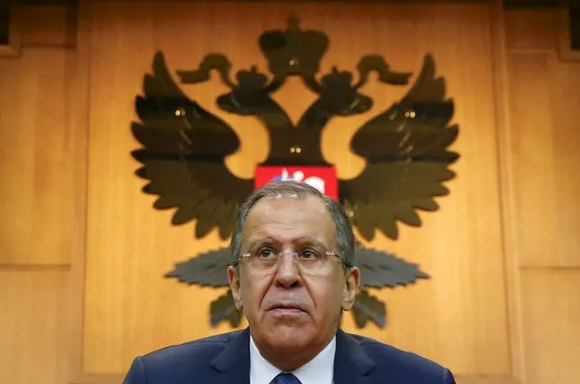 Russian Foreign Minister Sergei Lavrov leaves after giving a news conference in Moscow, Russia, January 26, 2016. Ukraine is dragging its feet on implementation of the Minsk peace agreement because it wants to keep in place the Western sanctions imposed on Russia, Lavrov said on Tuesday. (Photo by Maxim Shemetov/Reuters)