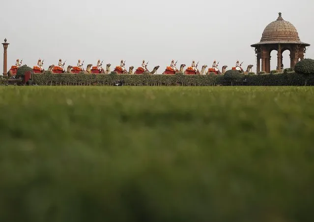 India's Border Security Force (BSF) soldiers ride their camels during a rehearsal for the “Beating the Retreat” ceremony in New Delhi, India, January 27, 2016. (Photo by Anindito Mukherjee/Reuters)