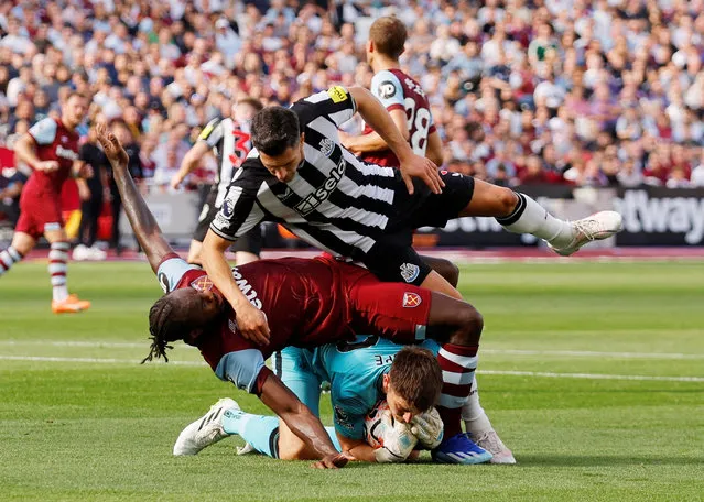 West Ham United's Michail Antonio in action with Newcastle United's Nick Pope and Fabian Schar during their Premier League match in London on October 8, 2023. (Photo by Andrew Couldridge/Action Images via Reuters)