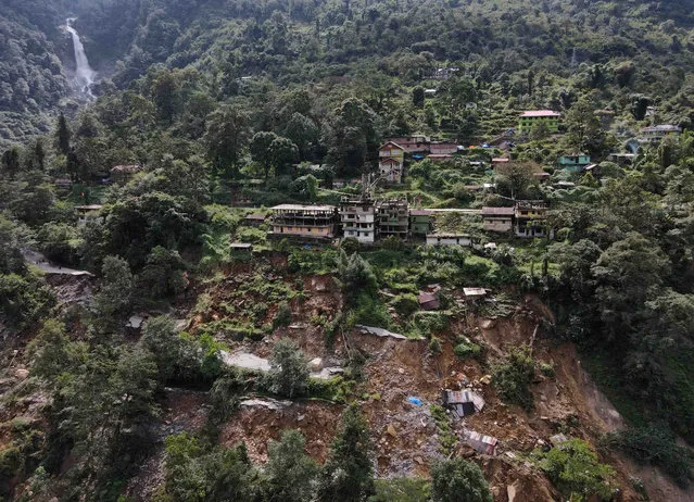 A drone view of damaged roads and houses that were washed away by flash floods in Naga-Namgor village, Sikkim, India on October 10, 2023. (Photo by Francis Mascarenhas/Reuters)