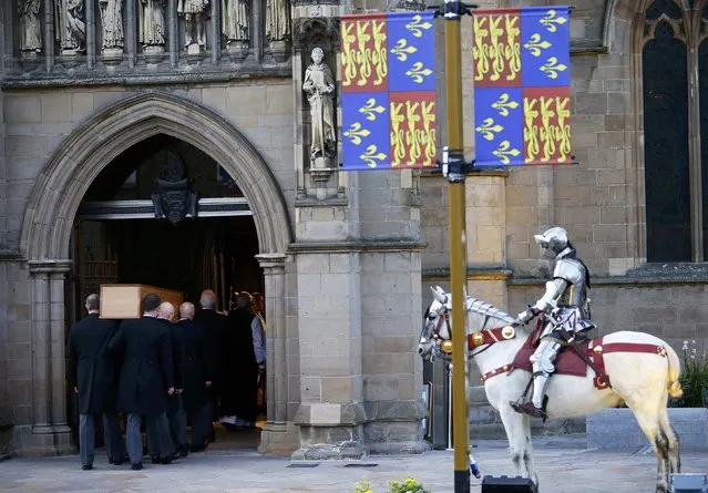 King Richard III's coffin is carried into Leicester Cathedral in Leicester, central England, March 22, 2015. Richard III's remains were carried in procession through Leicestershire today on its way to the cathedral where they will be reburied. The body of Richard III, who died at the battle of Bosworth in 1485, was found under a car park in 2012. (Photo by Darren Staples/Reuters)