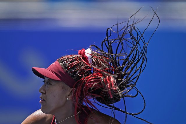 Naomi Osaka, of Japan, plays against Saisai Zheng, of China, during the first round of the tennis competition at the 2020 Summer Olympics, Sunday, July 25, 2021, in Tokyo, Japan. (Photo by Seth Wenig/AP Photo)