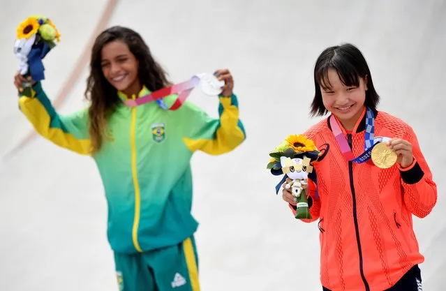 Silver medalist Rayssa Leal (L) of Team Brazil and gold medalist Momiji Nishiya of Team Japan pose at the medal ceremony for the Women's Street on day three of the Tokyo 2020 Olympic Games at Ariake Urban Sports Park on July 26, 2021 in Tokyo, Japan. (Photo by Toby Melville/Reuters)