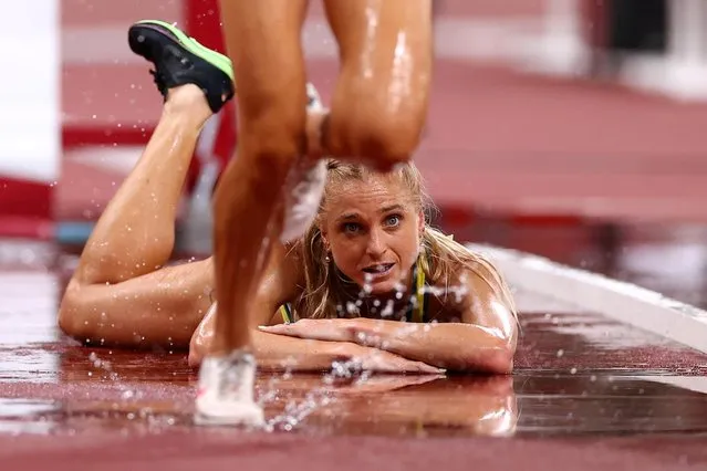 Australia's Genevieve Gregson gets injured during the women's 3000m steeplechase final during the Tokyo 2020 Olympic Games at the Olympic Stadium in Tokyo on August 4, 2021. (Photo by Andrew Boyers/Reuters)