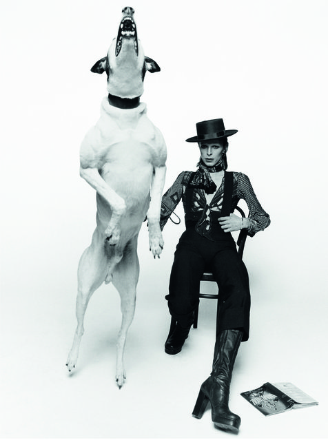 David Bowie, 1974. David Bowie's quirky character and style was perfectly encapsulated in this shot by Terry O'Neill, which shows the music legend posing next to a barking dog on the artwork for his 1974 album “Diamond Dogs” in London. (Photo by Terry O'Neill)