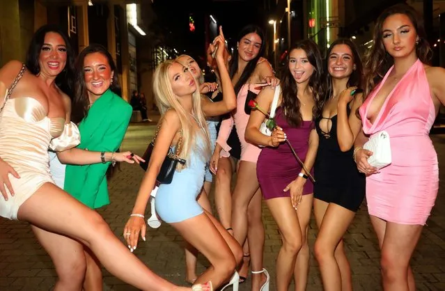 Young women posed for photos as they hit the town in Leeds, United Kingdom on September 25, 2021. Hordes of booze-fuelled youngsters poured into pubs and clubs on Saturday night before hitting the books when uni starts. (Photo by Nb press ltd)