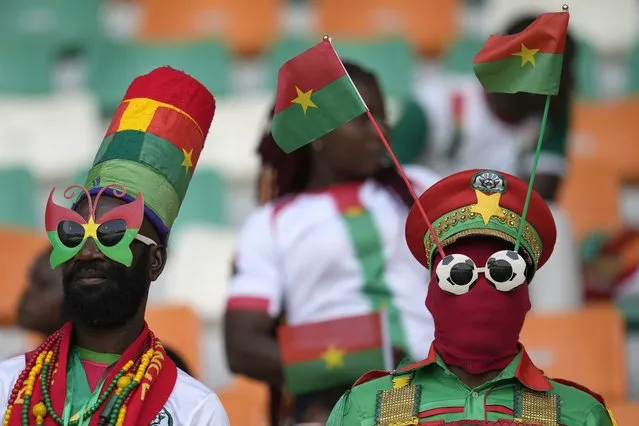 Burkina Faso fans cheer before the start of the African Cup of Nations round of 16 soccer match between Mali and Burkina Faso, at the Amadou Gon Coulibaly stadium in Korhogo, Ivory Coast, Tuesday, January 30, 2024. (Photo by Themba Hadebe/AP Photo)