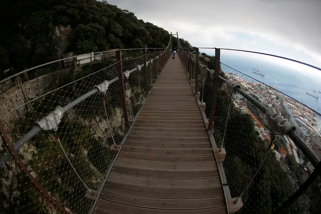 Tourists cross the Windsor Bridge on the top of the Rock in the British overseas territory of Gibraltar, historically claimed by Spain April 18, 2018. (Photo by Jon Nazca/Reuters)