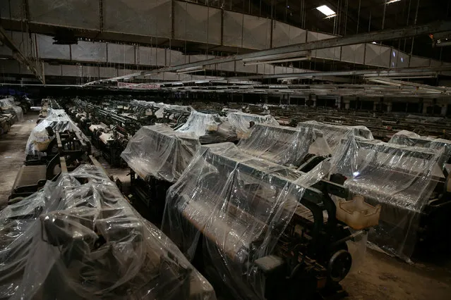 Textile-weaving machines are covered at a closed-down textile factory in Kaduna, Nigeria November 3, 2016. (Photo by Afolabi Sotunde/Reuters)