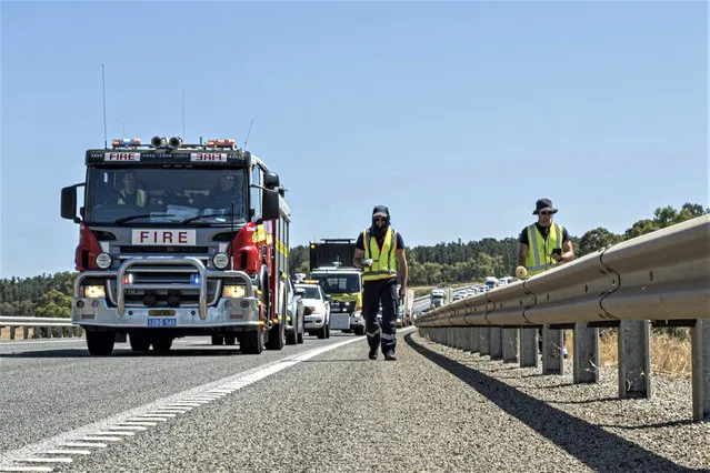 In this photo provided by the Department of Fire and Emergency Services, its members search for a radioactive capsule believed to have fallen off a truck being transported on a freight route on the outskirts of Perth, Australia, Saturday, January 28, 2023. A mining corporation on Sunday apologized for losing the highly radioactive capsule over a 1,400-kilometer (870-mile) stretch of Western Australia, as authorities combed parts of the road looking for the tiny but dangerous substance. (Photo by Department of Fire and Emergency Services via AP Photo)