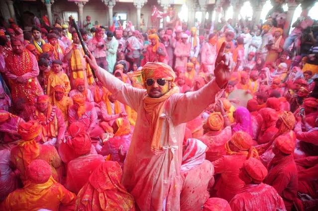 A Hindu devotee takes part in Laddu maar Holi at “Radha Rani Temple” at Barsana, Mathura in India on March 6, 2017. (Photo by Prabhat Kumar Verma/Pacific Press/LightRocket via Getty Images)