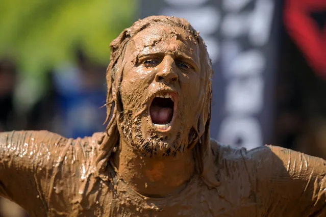 A participant takes part in the first Mud Day Israel obstacle course race in Tel Aviv, Israel March 24, 2017. (Photo by Baz Ratner/Reuters)