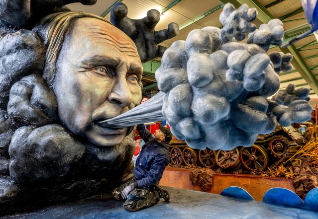 A carnival float with a figure depicting Russian President Vladimir Putin is presented during a press preview for the Mainz carnival in Mainz, Germany, Tuesday, February 14, 2023. (Photo by Michael Probst/AP Photo)