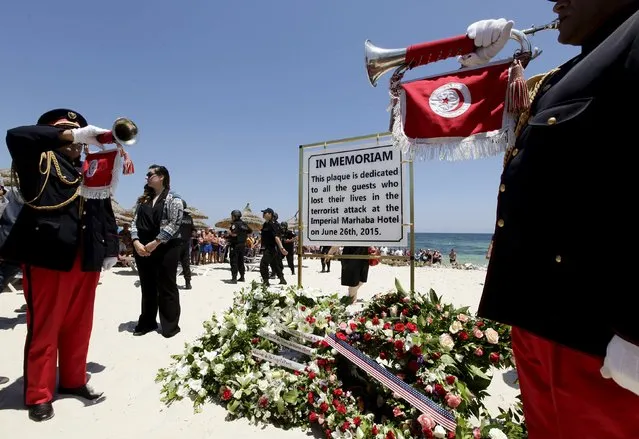 A plaque dedicated to those killed in a recent attack by an Islamist gunman, is seen at the beach where the attack took place during a minute's silence in Sousse, Tunisia July 3, 2015. (Photo by Anis Mili/Reuters)