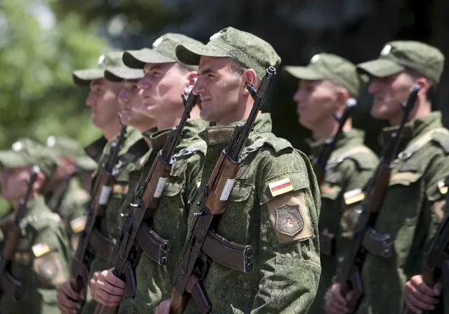 Servicemen of the military forces of South Ossetia attend an oath of allegiance ceremony in Tskhinvali, the capital of the breakaway region of South Ossetia, Georgia, July 5, 2015. (Photo by Kazbek Basaev/Reuters)