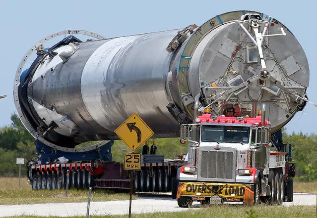 The recovered first stage of a SpaceX Falcon 9 rocket is transported to the SpaceX hangar at launch pad 39A at the Kennedy Space Center in Cape Canaveral, Florida May 14, 2016. The vehicle was launched on May 6 and returned to land a short time later aboard a barge in the Atlantic Ocean. (Photo by Joe Skipper/Reuters)