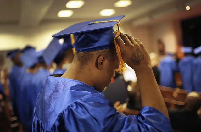 Inmate Jamar Allah flips his tassel as a graduate before receiving his High School GED (General Equivalency Diploma) along with 26 others at a graduation ceremony for inmates at the George Motchan Detention Center at New York City's Rikers Island correctional facility June 26, 2012. (Photo by Mike Segar/Reuters)