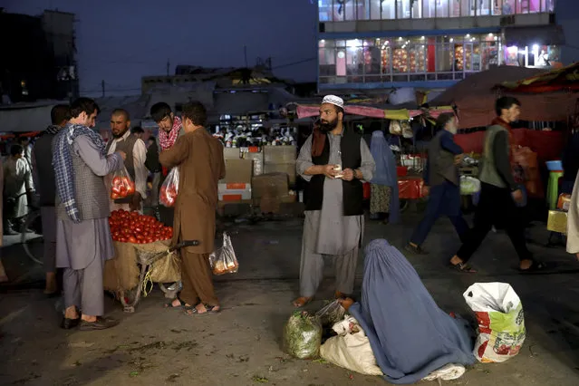 People shop at a market in the old city of Kabul, Afghanistan, Sunday, September 8, 2019. (Photo by Ebrahim Noroozi/AP Photo)