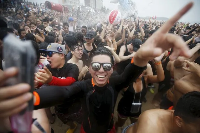 A tourists takes a selfie as he attends the Boryeong Mud Festival at Daecheon beach in Boryeong, South Korea, July 18, 2015. (Photo by Kim Hong-Ji/Reuters)