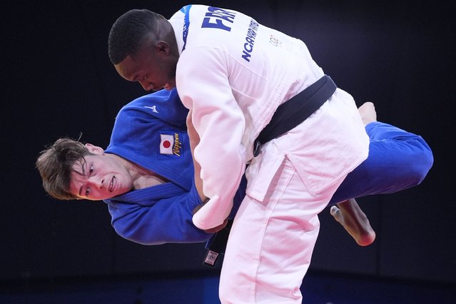 France's Maxime-Gael Ngayap Hambou and Japan's Sanshiro Murao compete during their men's -90 kg semifinal match in the team judo competition, at Champ-de-Mars Arena, during the 2024 Summer Olympics, Wednesday, July 31, 2024, in Paris, France. (Photo by Eugene Hoshiko/AP Photo)