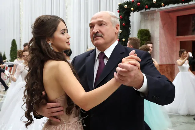 Miss Belarus 2018 Winner Maria Vasilevich (L) and Belarus' President Alexander Lukashenko dance at the republican Christmas youth ball held in the Palace of Independence in Minsk, Belarus on December 28, 2018. Almost 300 distinguished students and school-leavers invited including presidential grant-holders, participants in republican creative and scientific contests, winners of numerous international and republican festivals. (Photo by Nikolai Petrov/TASS)