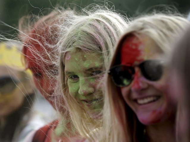 People attend the Holi festival, or the Festival of Colors, in Riga, Latvia, August 1, 2015. (Photo by Ints Kalnins/Reuters)