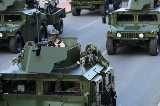 A sniper is seen on a armored vehicle at a military parade in downtown of Zagreb, Croatia, August 4, 2015. (Photo by Antonio Bronic/Reuters)