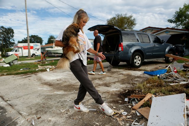 Sandra White prepares to evacuate from her home with her partner Scott Pepperman, and their dog Buoy ahead of the arrival of Hurricane Milton in New Port Richey, Florida on October 8, 2024. (Photo by Octavio Jones/Reuters)