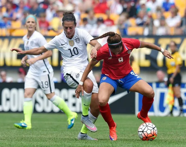 United States midfielder Carli Lloyd (10) battles for a ball against Costa Rica defender Carolina Venegas (9) during the first half of a women's friendly soccer match on Sunday, August 16, 2015, in Pittsburgh. (Photo by Don Wright/AP Photo)