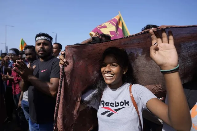Protesters shout slogans against president Gotabaya Rajapaksa outside his office in Colombo, Sri Lanka, Wednesday, July 13, 2022. (Photo by Eranga Jayawardena/AP Photo)