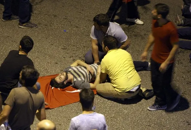 An injured man is attended during an attempted coup in Ankara, Turkey July 16, 2016. (Photo by Reuters/Stringer)