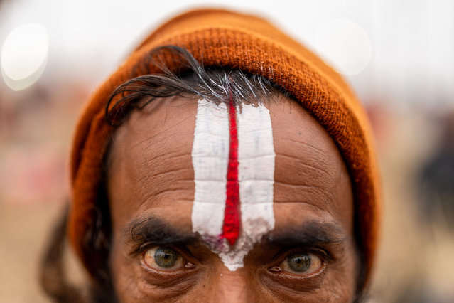 A Sadhu, whose face is painted with traditional design, looks after take a holy dip at Sangam, the confluence of rivers Ganga, Yamuna, and mythical Saraswati on the occasion of Paush Purnima during the Maha Kumbh Mela festival in Prayagraj, Uttar Pradesh, India on January 13, 2025. (Photo by Amarjeet Kumar Singh/Anadolu via Getty Images)