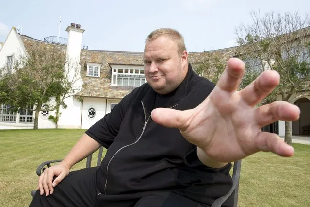 Kim Dotcom gestures towards a camera after an interview with Reuters in Auckland in this January 19, 2013 file photo. Nearly four years after dozens of black-clad police rappelled into his New Zealand mansion and cut him from a safe room, flamboyant German tech entrepreneur and would-be hip-hop star Kim Dotcom may finally be about to face the music. (Photo by Nigel Marple/Reuters)