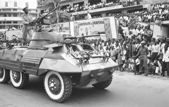 In this June 30, 1961 file photo, Congo celebrates the first anniversary of independence from Belgium with a large military parade in Leopoldville, the capital before it was later renamed in 1966 to Kinshasa, in Congo. On Tuesday, June 30, 2020 Congo is marking the 60th anniversary of achieving independence from the colonial rule of Belgium. (Photo by Horst Faas/AP Photo/File)