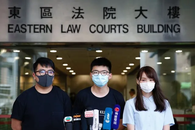 Pro-democracy activists Ivan Lam, Joshua Wong and Agnes Chow arrive to the Eastern Court for hearing in Hong Kong, China on July 6, 2020. (Photo by Tyrone Siu/Reuters)