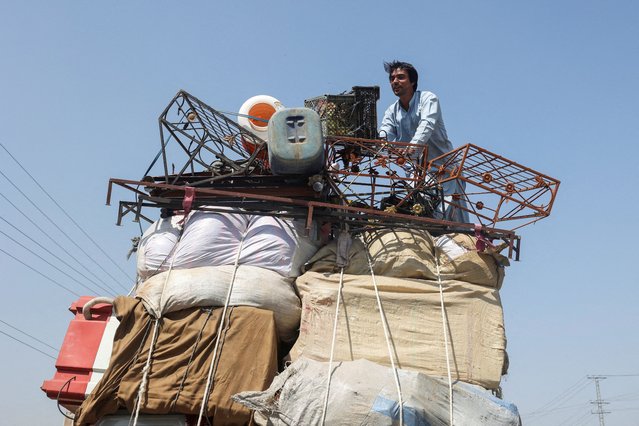 An Afghan refugee man loads a truck with his belongings, as he along with others returns home, after Pakistan gave the last warning to undocumented immigrants to leave, in Jamrud, Pakistan on April 14, 2025. (Photo by Fayaz Aziz/Reuters)