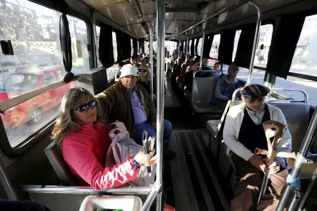 Laura Paipo, first blind principal in Uruguay travels by bus in Montevideo, September 18, 2015. (Photo by Andres Stapff/Reuters)