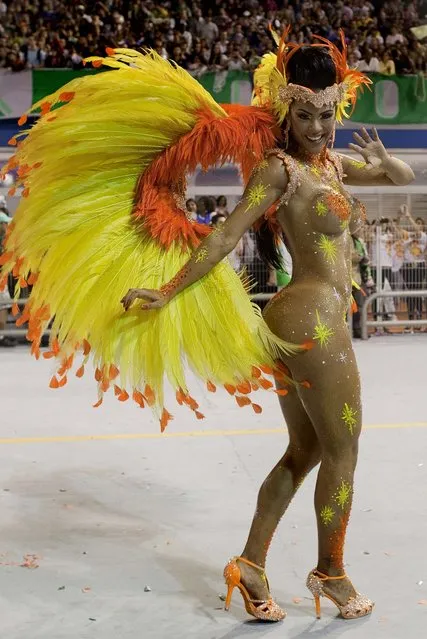 A dancer from the Mancha Verde samba school performs  in Sao Paulo. (Photo by Andre Penner/Associated Press)